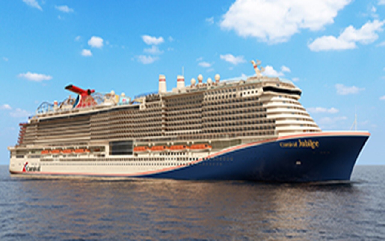 Carnival Jubilee at sea, with its red funnel and blue hull