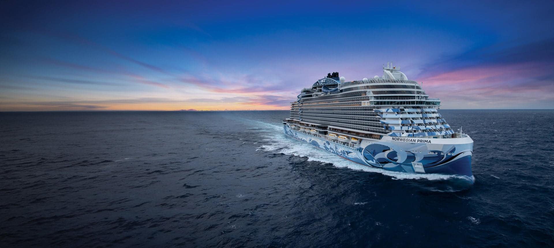 Norwegian Prima at sea beneath a twilight sky