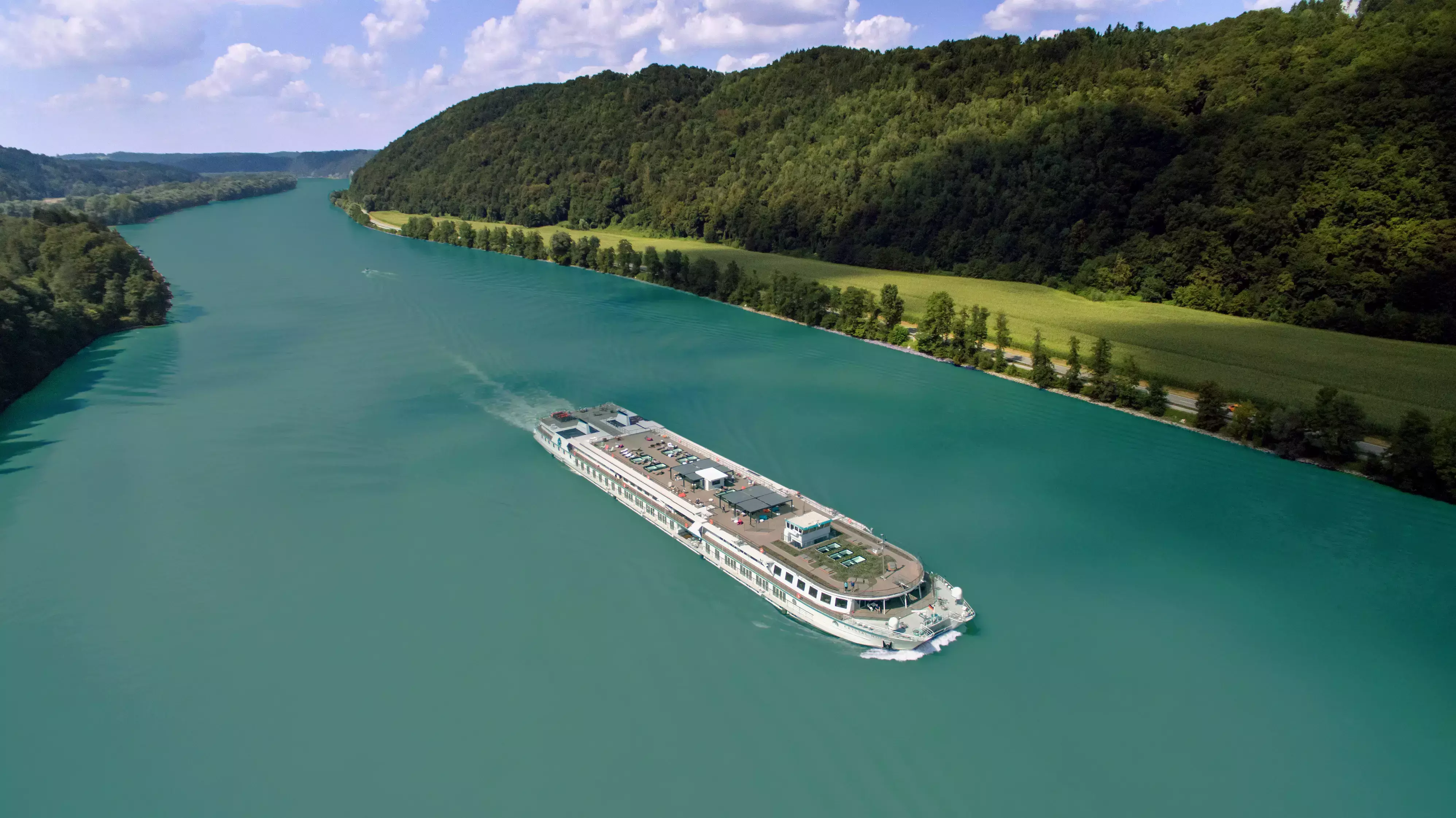 Riverside Mozart on a river bordered by forested Austrian hills