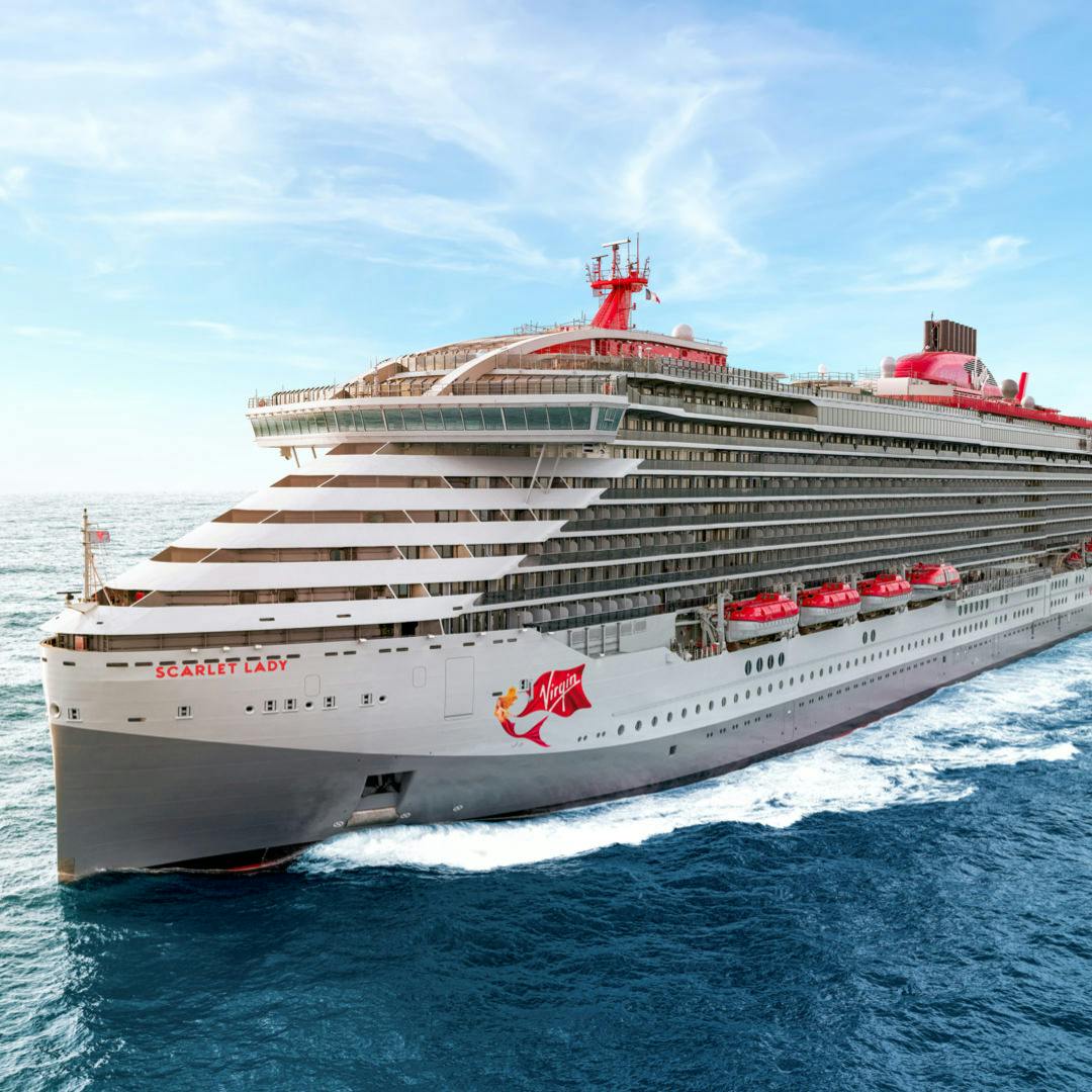 Scarlet Lady sailing through blue water